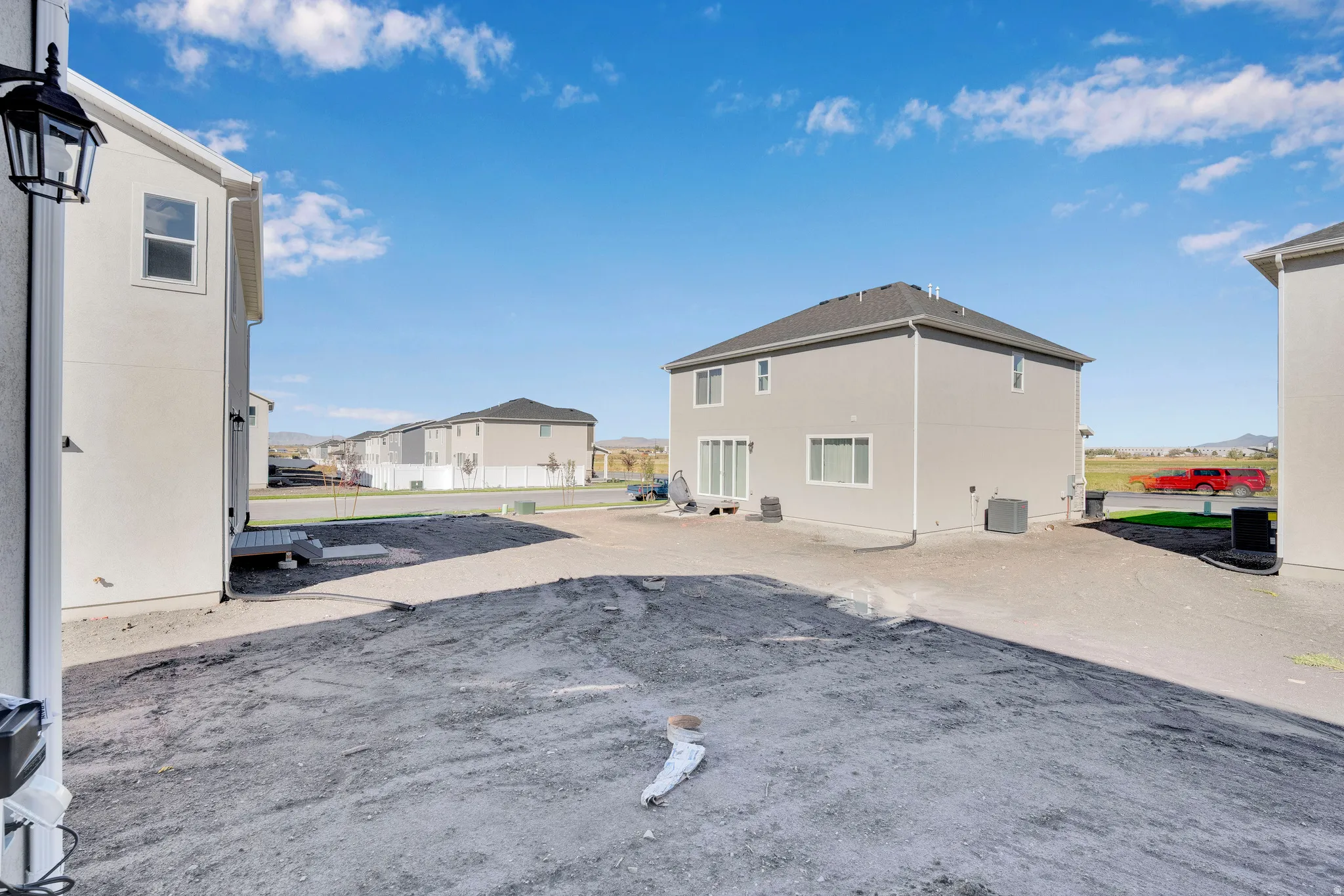 Exterior space with a residential view and a central AC unit