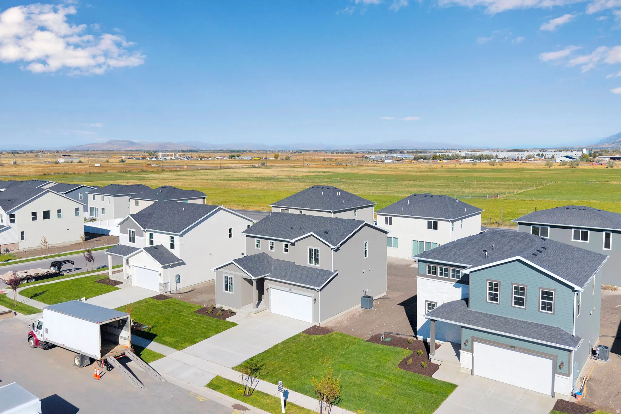 Aerial perspective of suburban area with a mountain backdrop