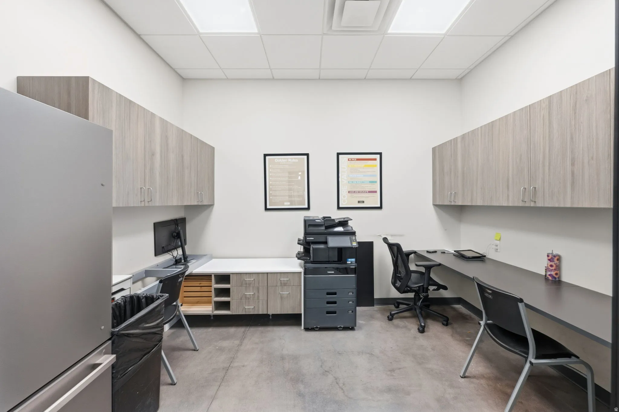 Office space featuring a paneled ceiling