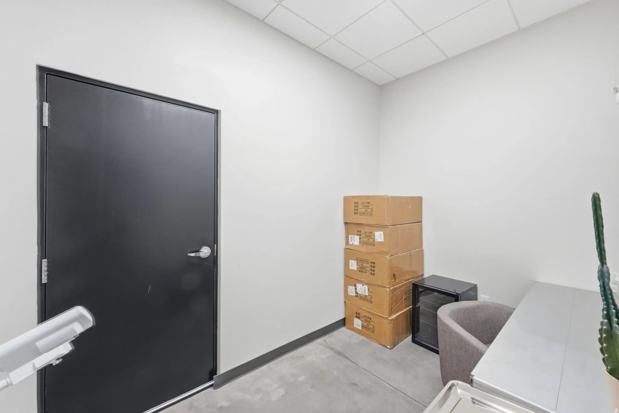 Office area with a paneled ceiling