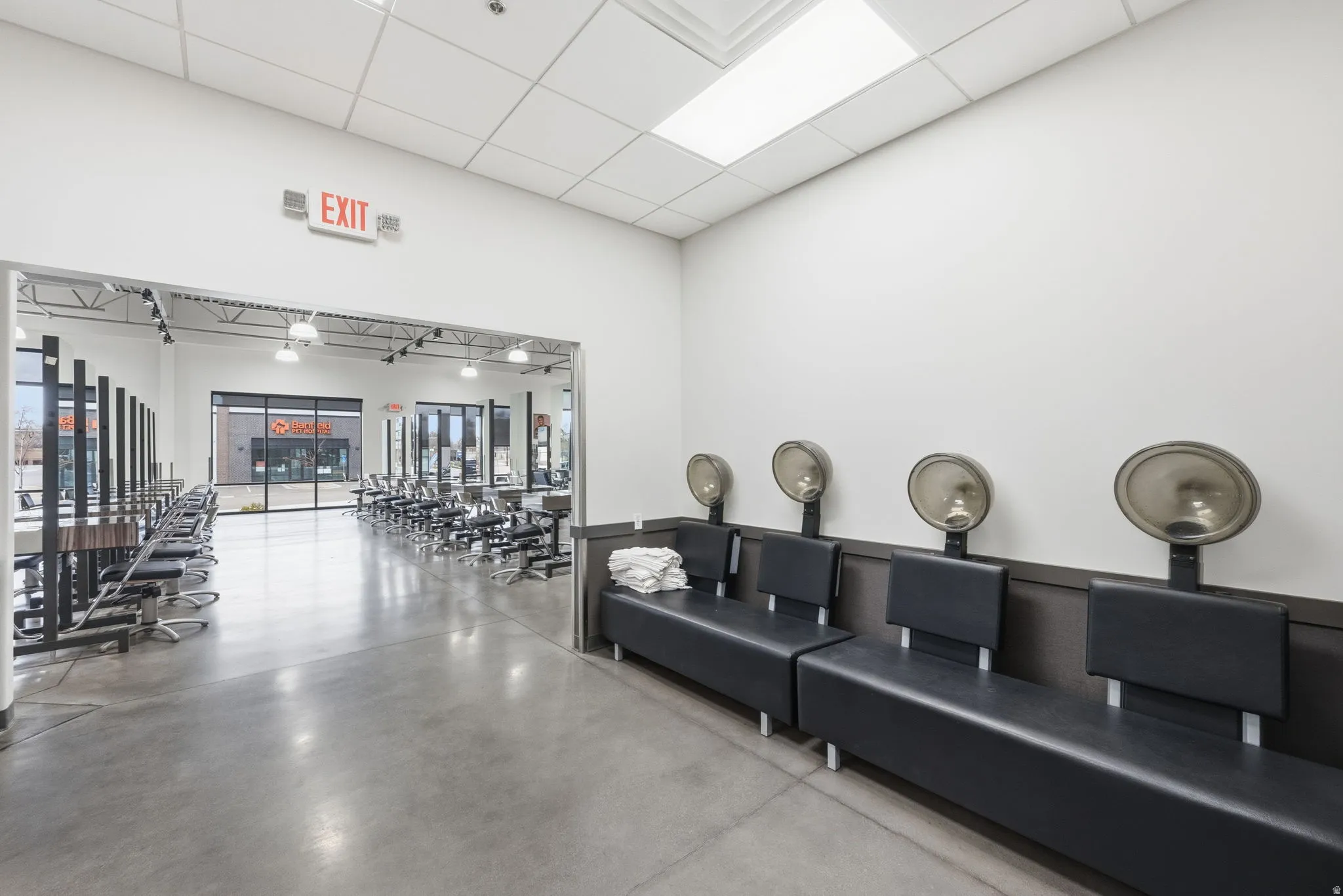 Community lobby featuring a paneled ceiling and a high ceiling