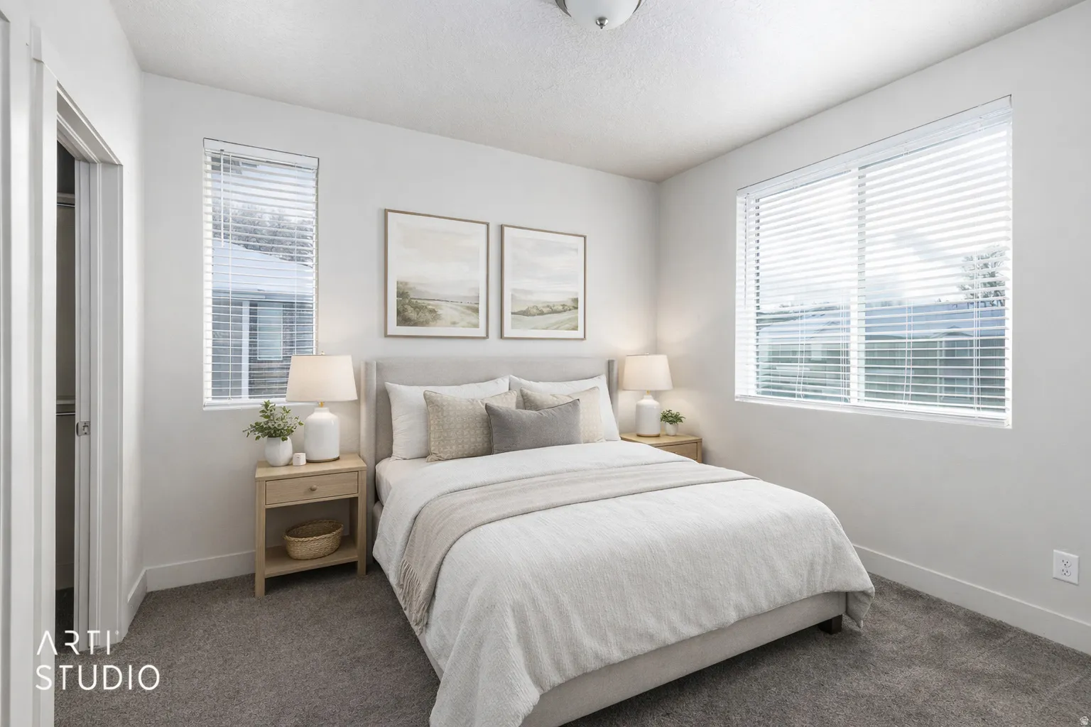 Bedroom with multiple windows and carpet