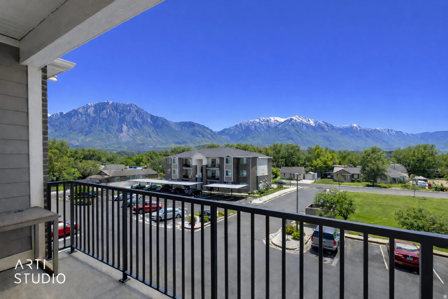 Balcony with a mountain view and a residential view