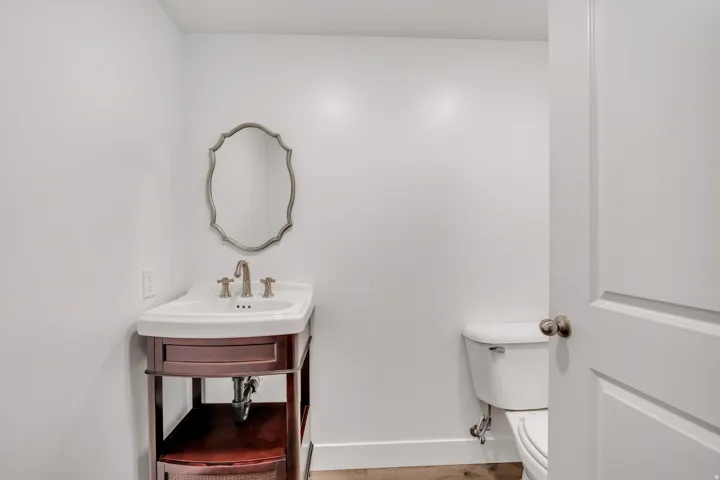 Half bath featuring toilet and vanity