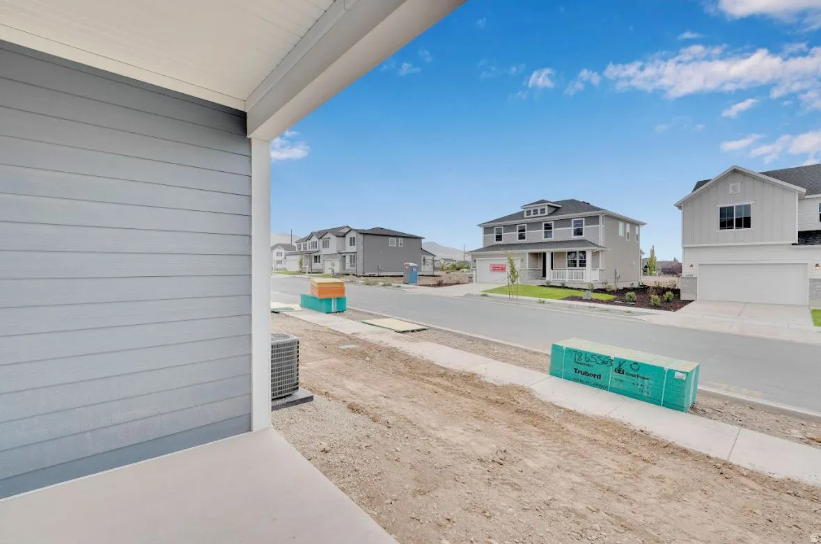 Covered porch with a residential view