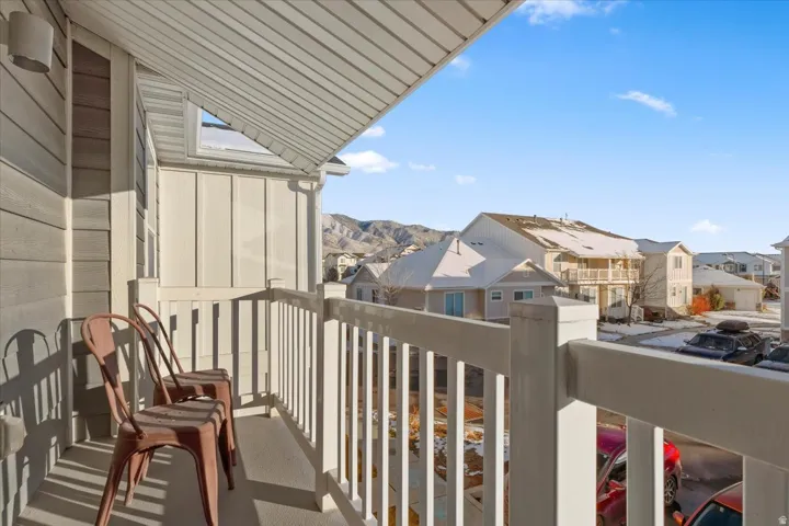 Primary bedroom balcony featuring a residential view