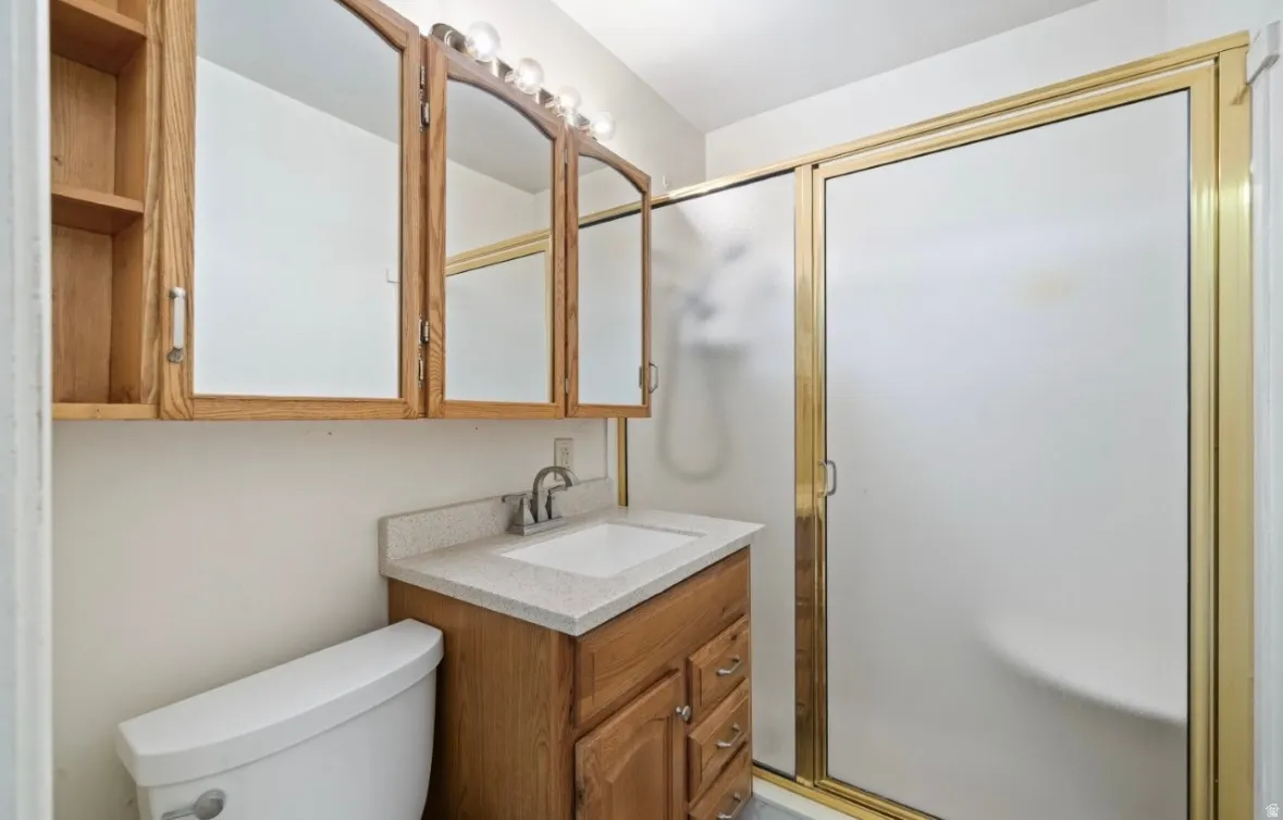 Bathroom with vanity and a shower stall