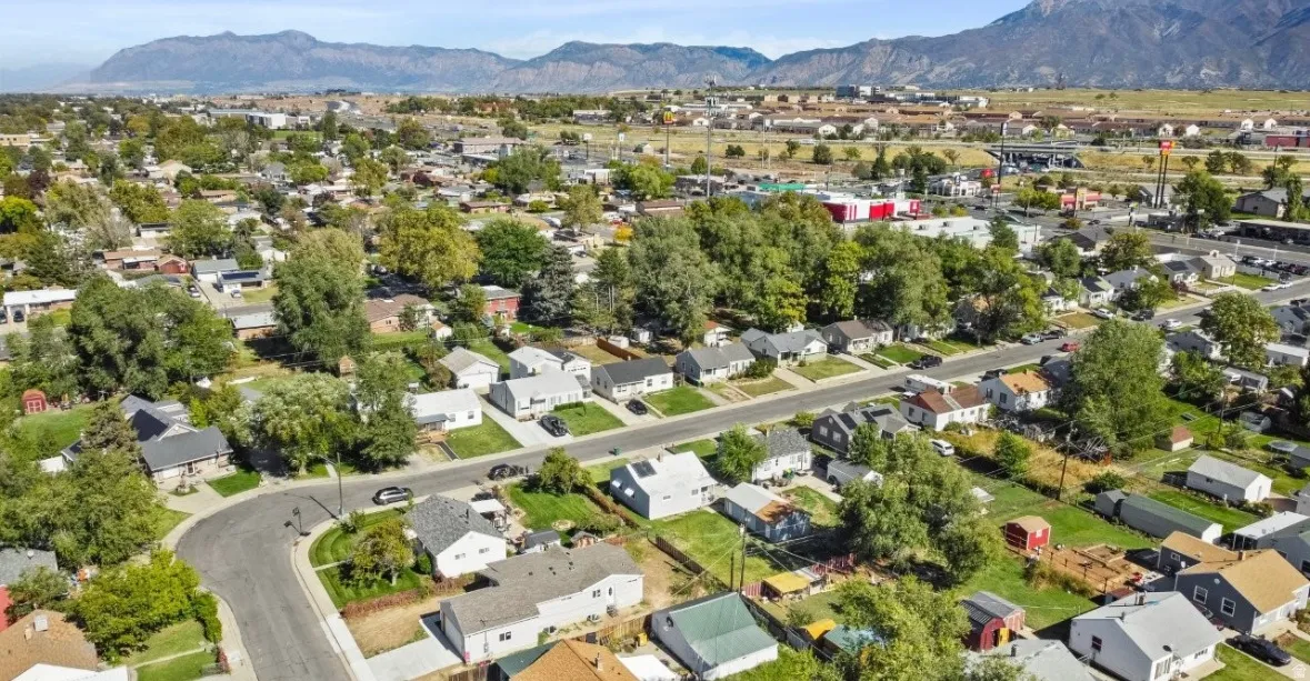 View of property location with nearby suburban area and a mountainous background