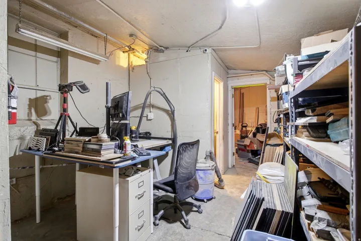 Home office with unfinished concrete flooring