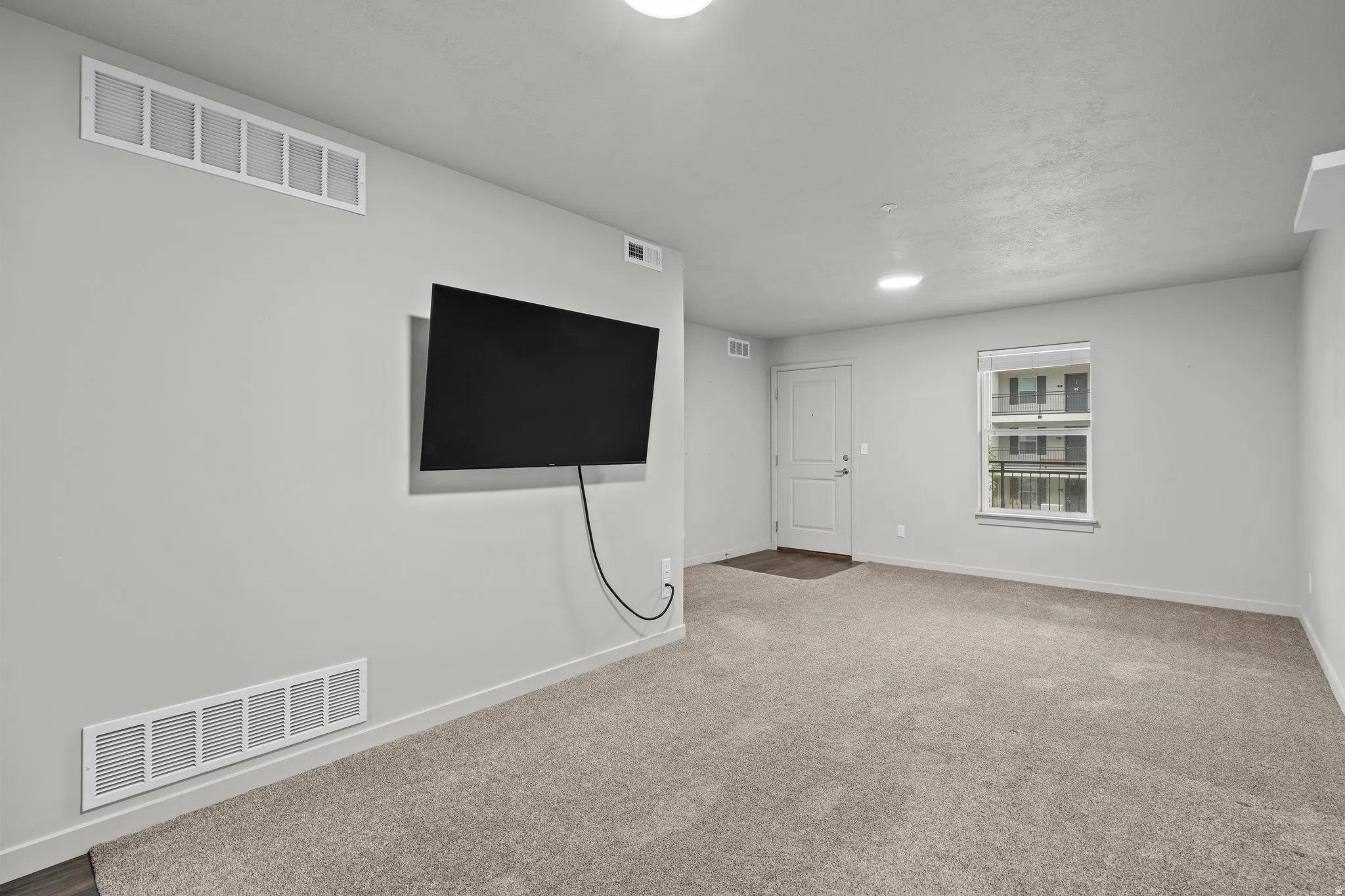 Below grade area with carpet and baseboards