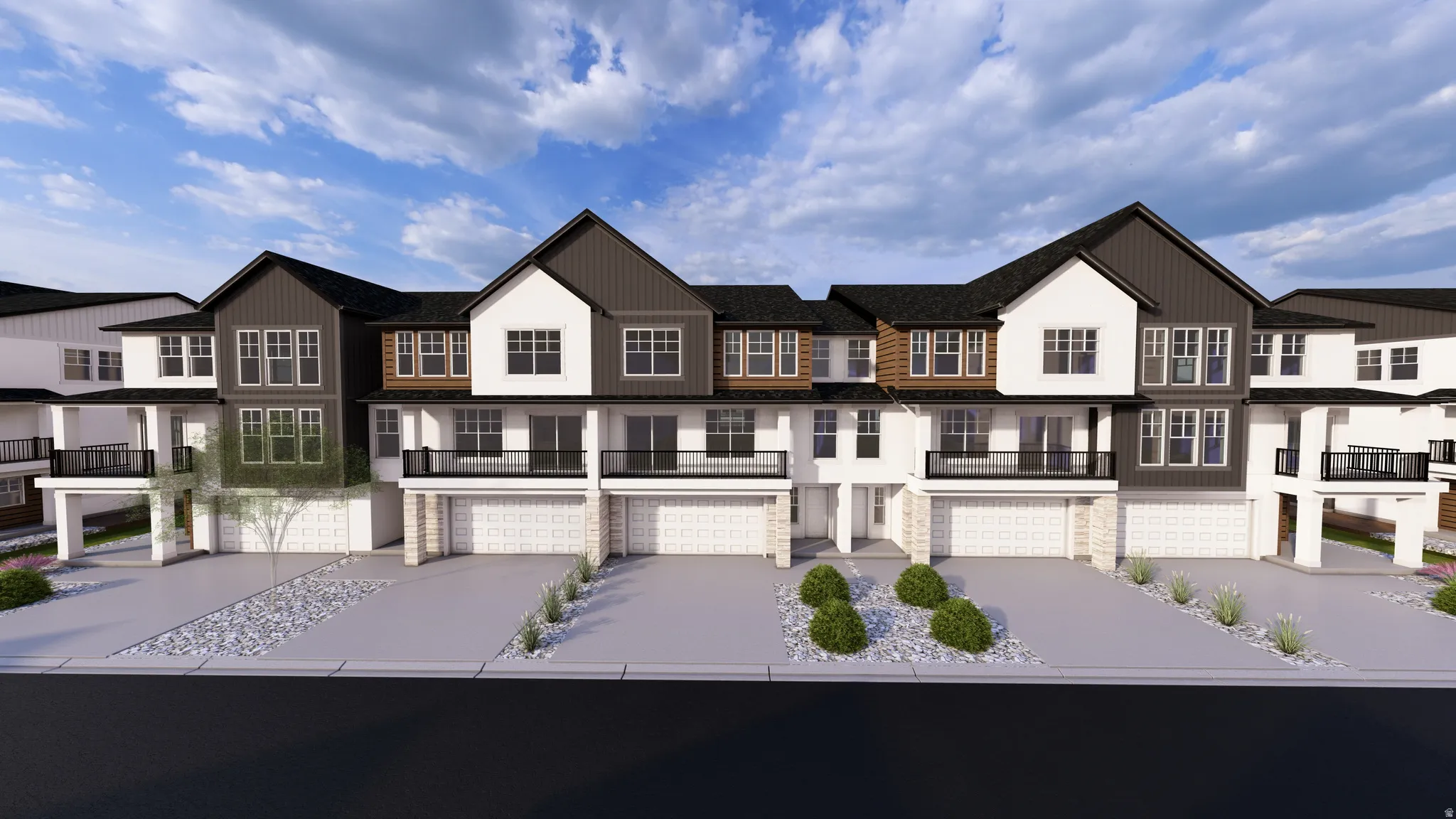 View of front of property featuring a residential view, a balcony, driveway, and stone siding