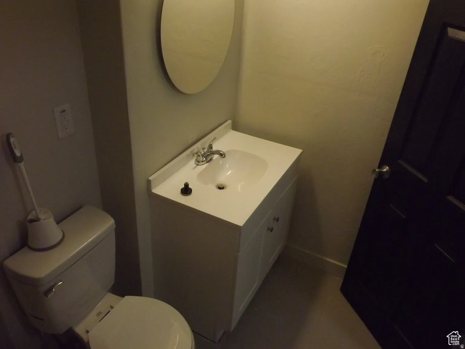 Full bathroom featuring vanity and toilet