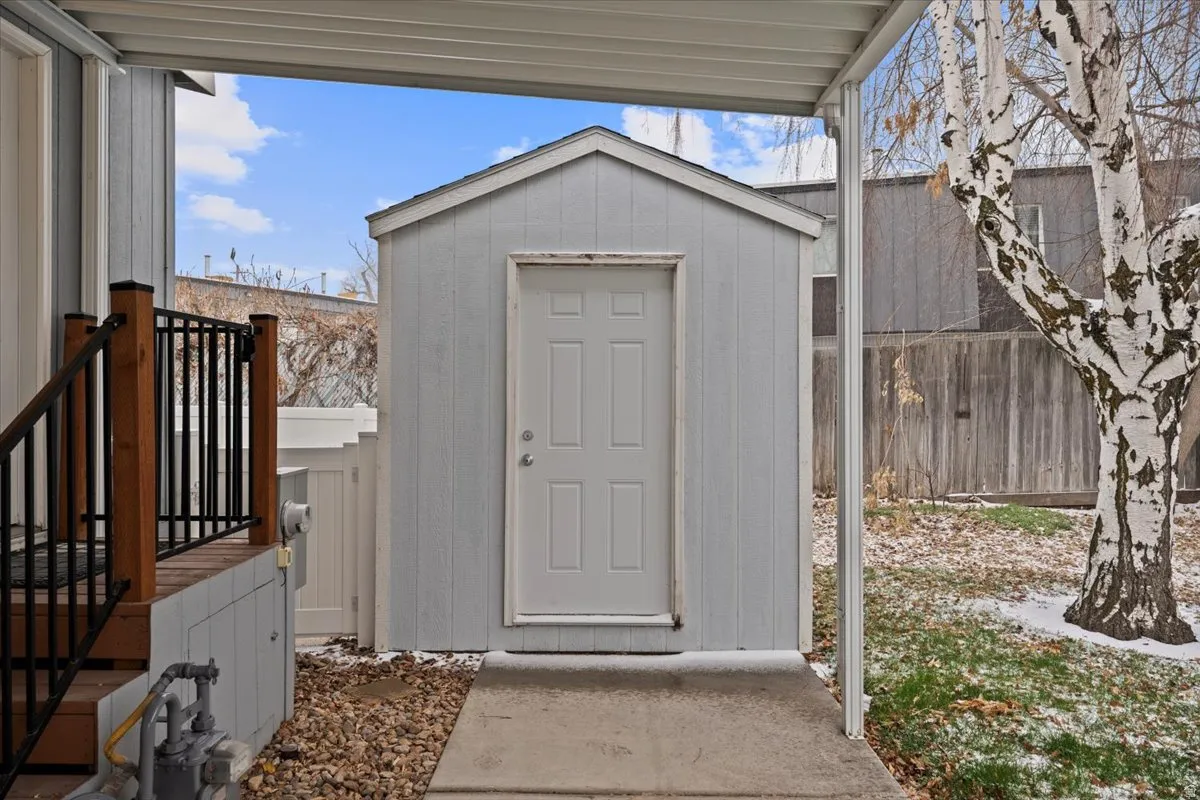 View of shed featuring a fenced backyard