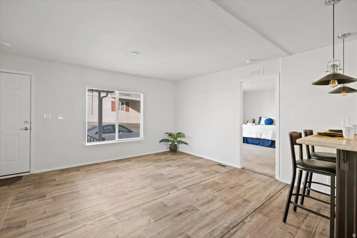 Dining room with light wood-style flooring and baseboards