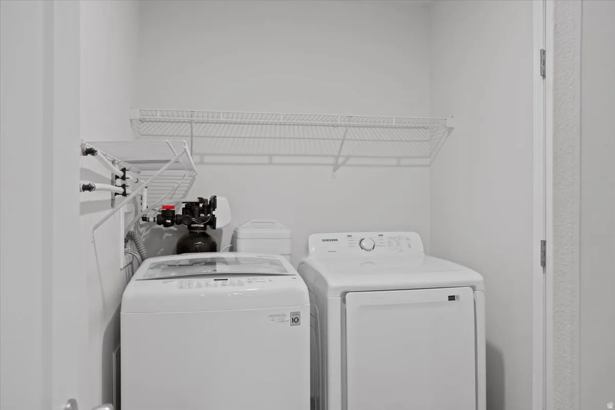Laundry area featuring washing machine and clothes dryer