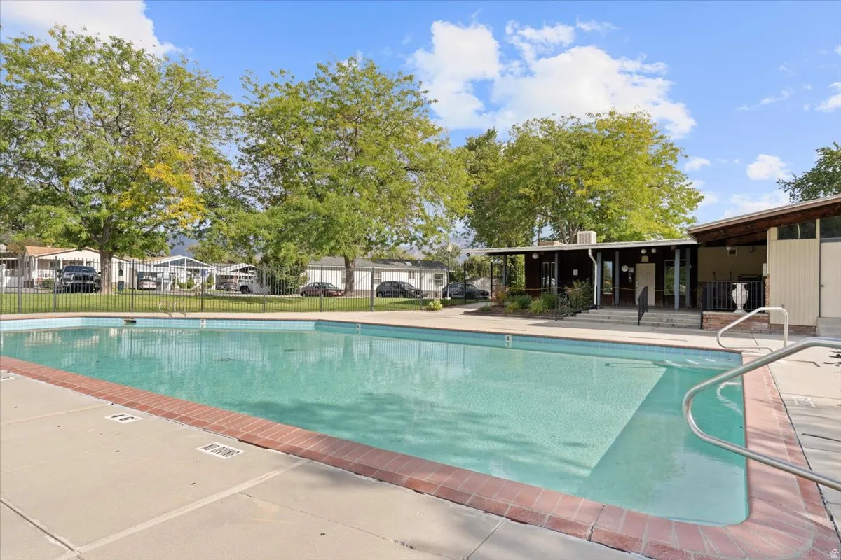 Community pool with a patio area