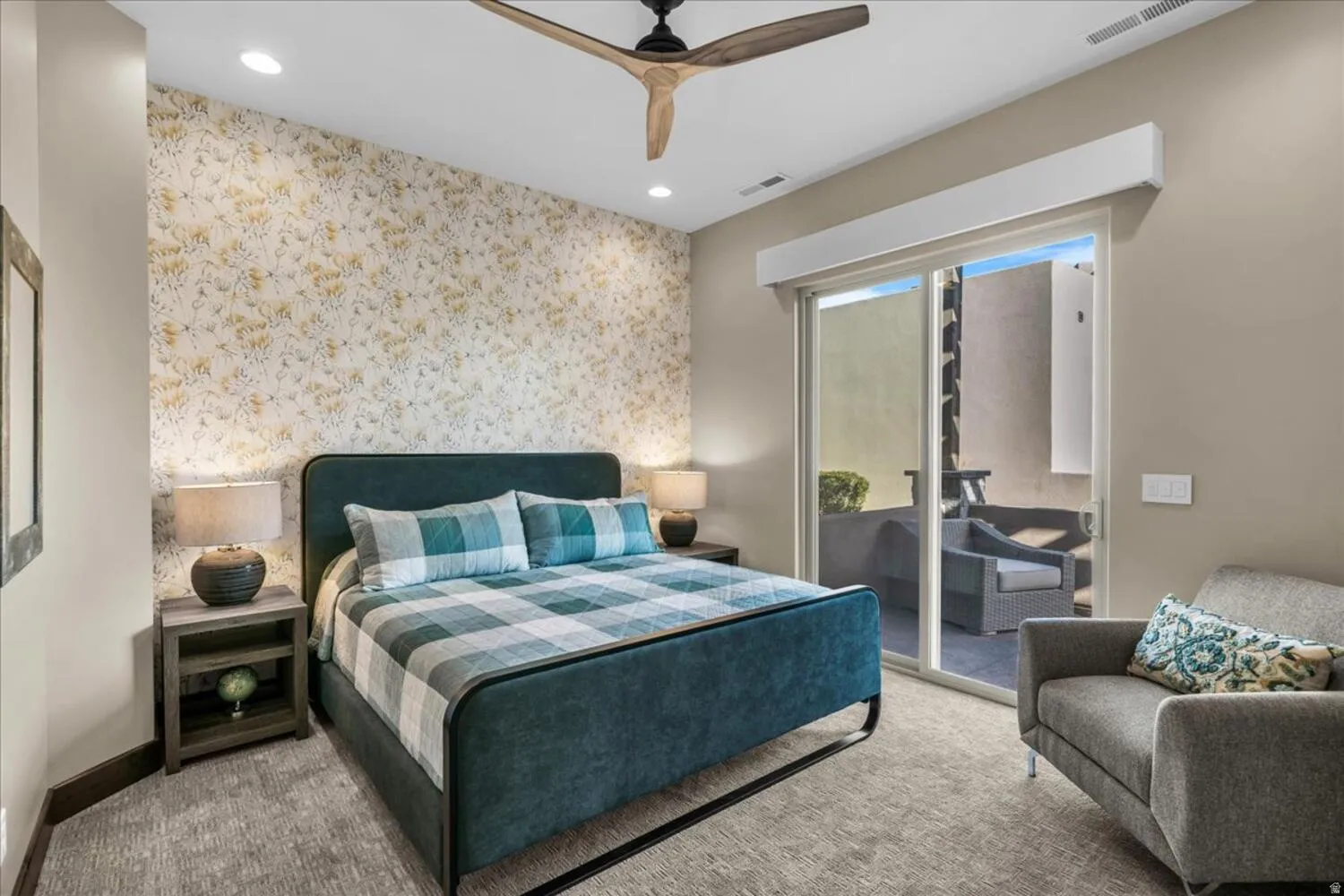 Carpeted bedroom with access to exterior, wallpapered walls, ceiling fan, recessed lighting, and an accent wall