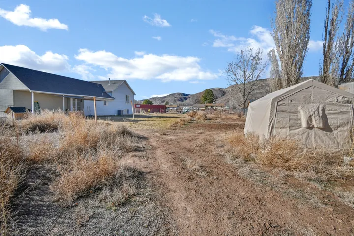 View of dirt / gravel road with a mountain view