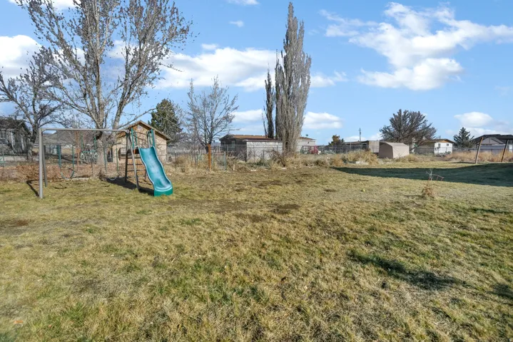 View of yard featuring a playground