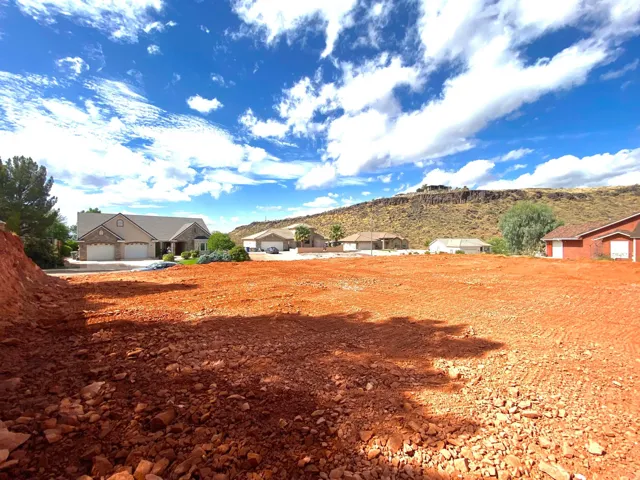 View of yard with a garage