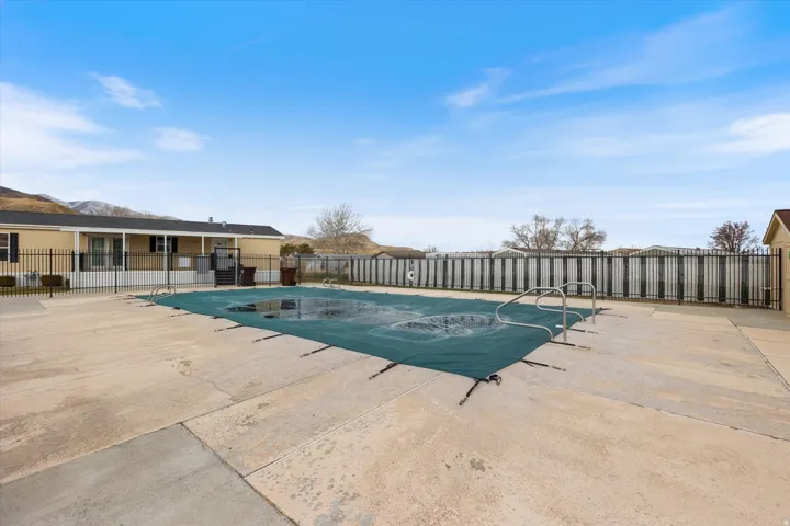 Community pool featuring a patio area