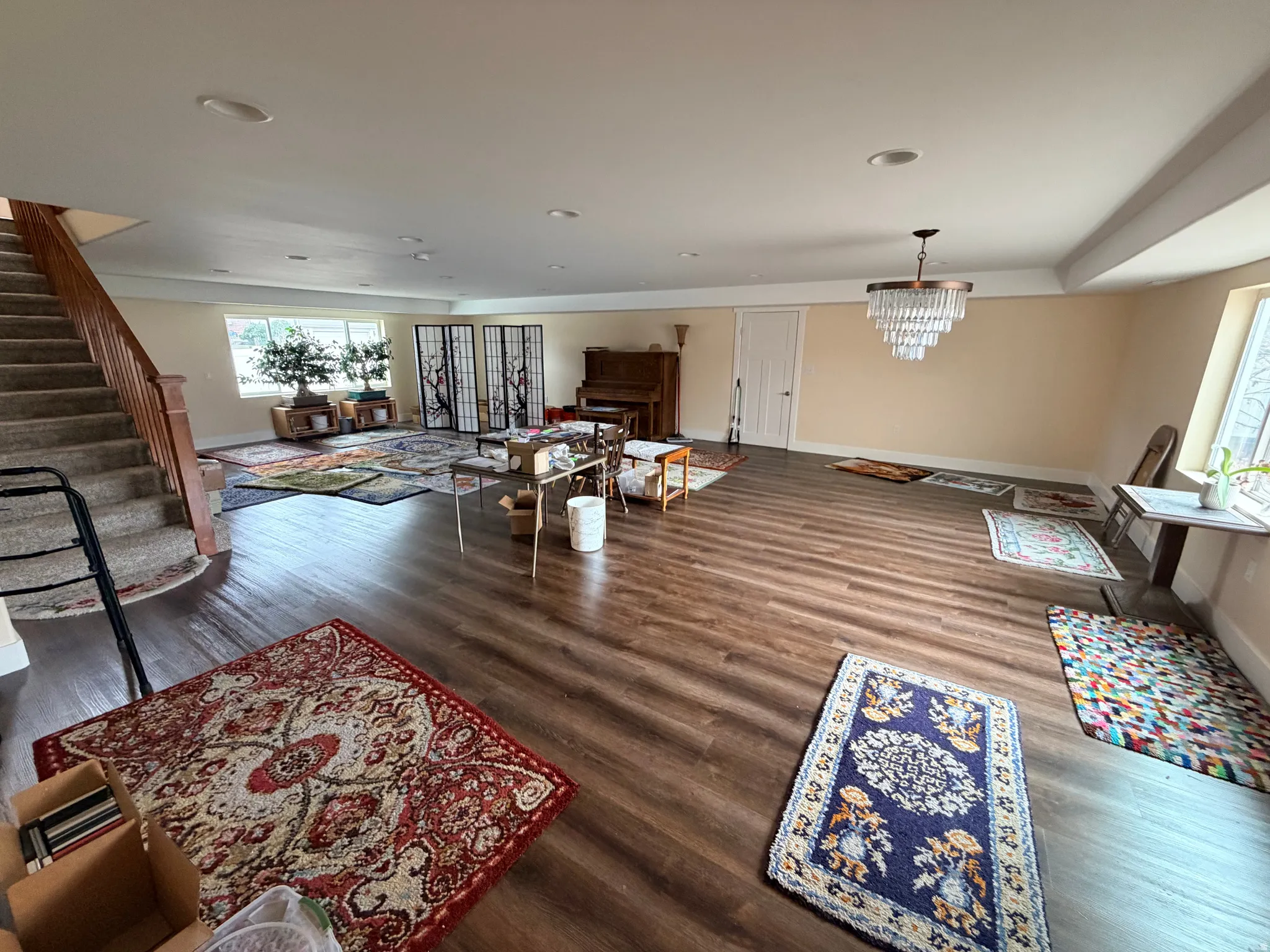 Living room featuring stairway and dark wood-type flooring