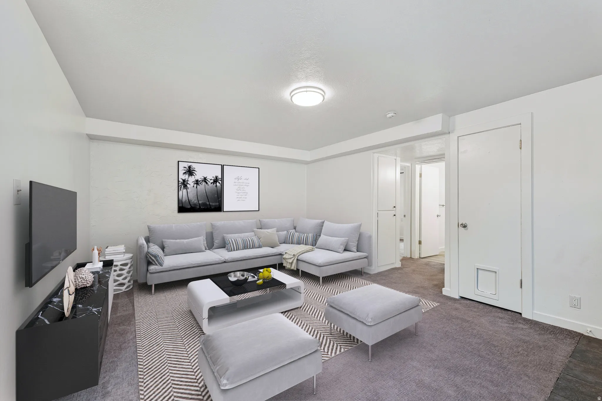 Living room with baseboards and carpet