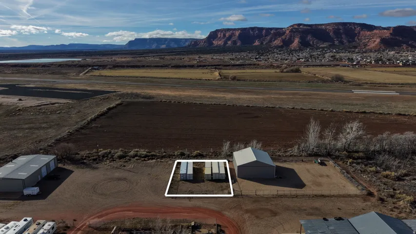 Overview of rural landscape with a mountainous background and property boundaries highlighted