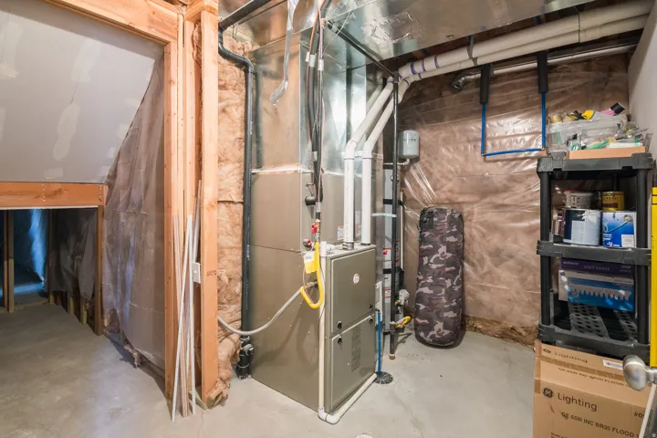 Utility room featuring heating unit