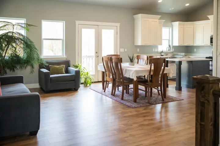 Dining room with french doors, dark wood-style flooring, and recessed lighting