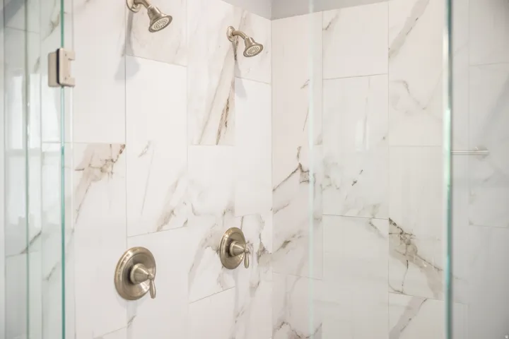 Bathroom with a marble finish shower