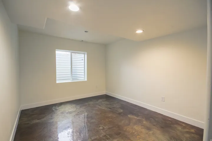 Unfurnished room featuring concrete flooring and recessed lighting