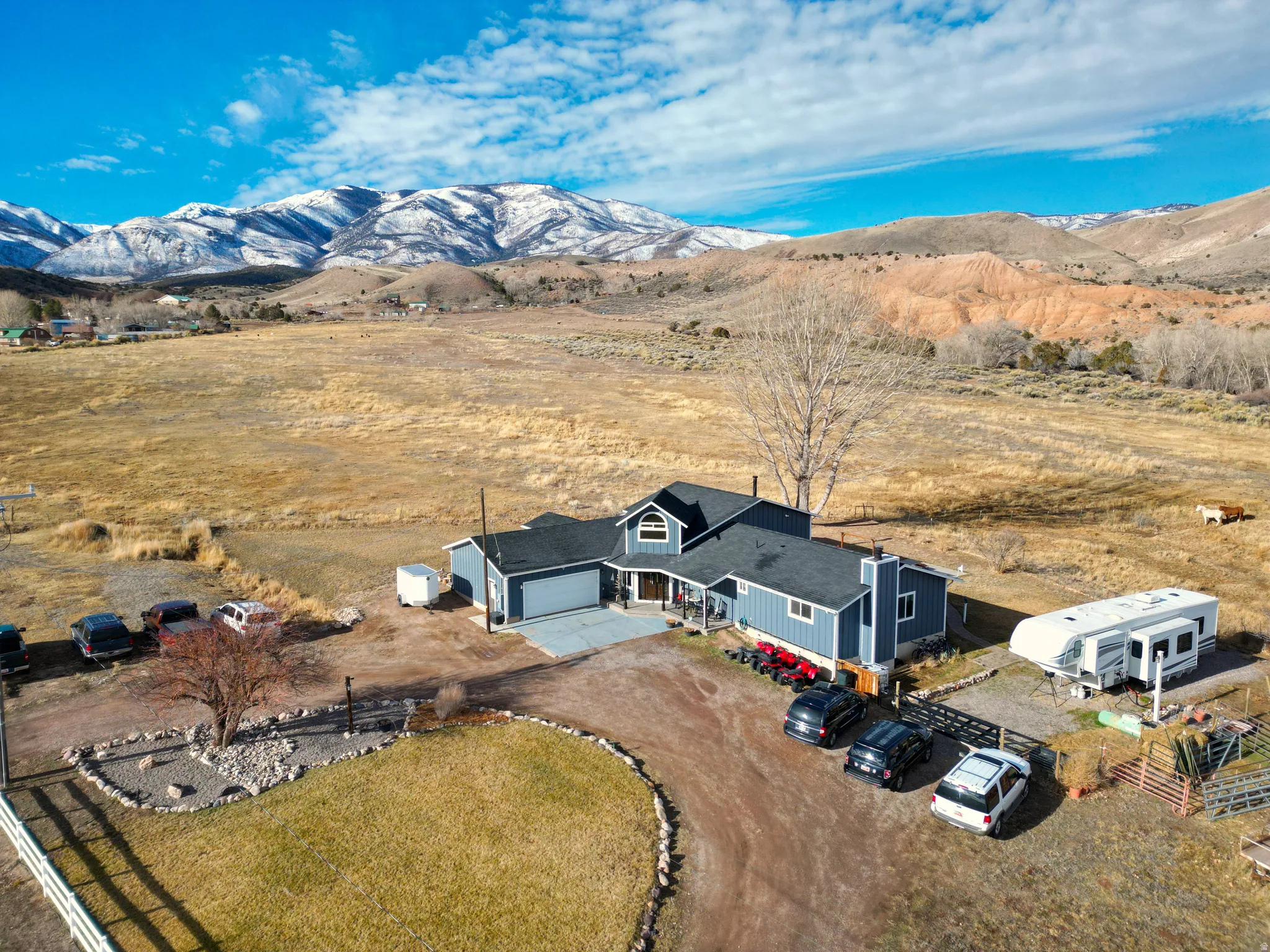 Overview of rural landscape featuring a mountainous background