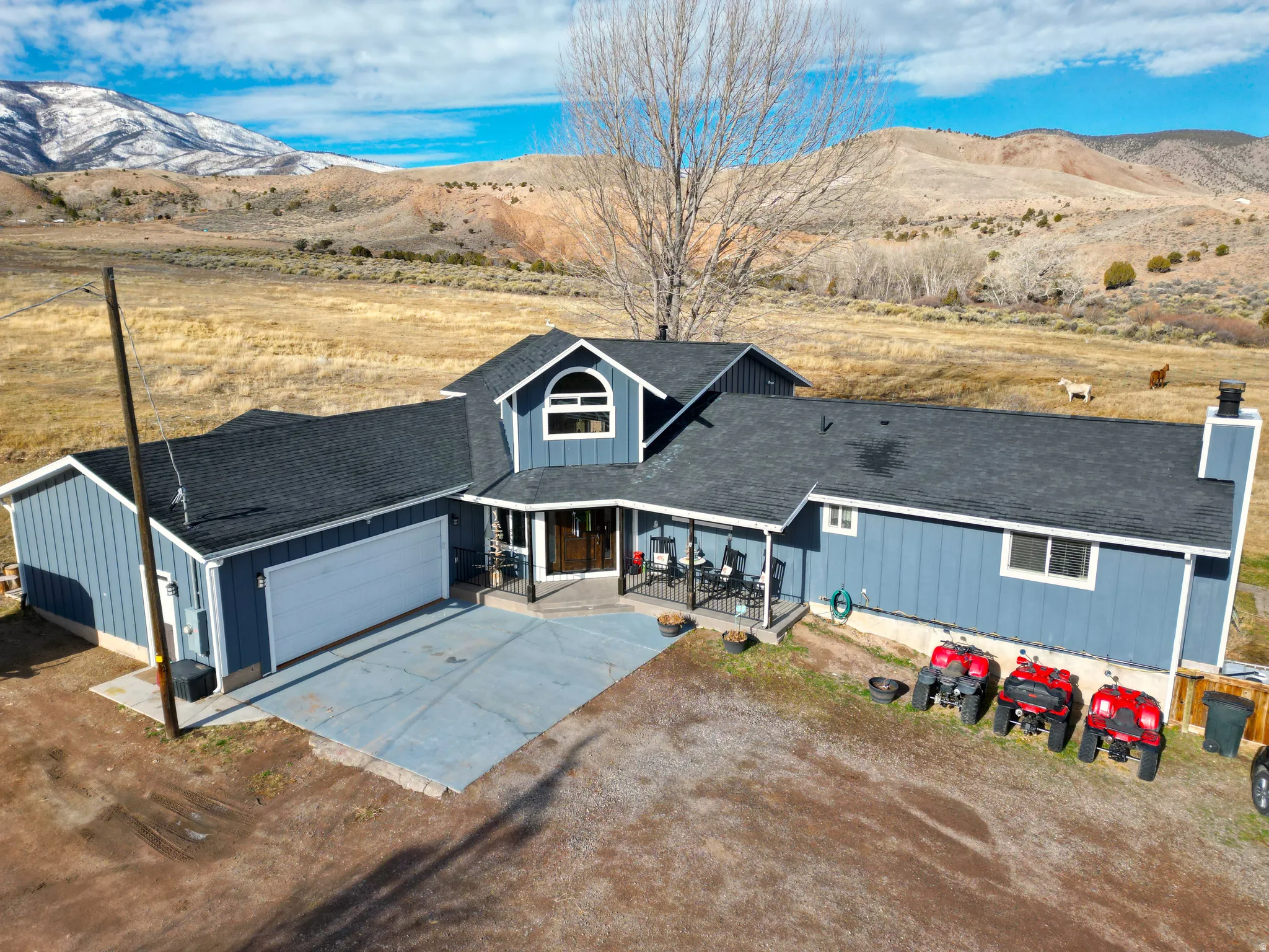 View of subject property featuring a mountainous background