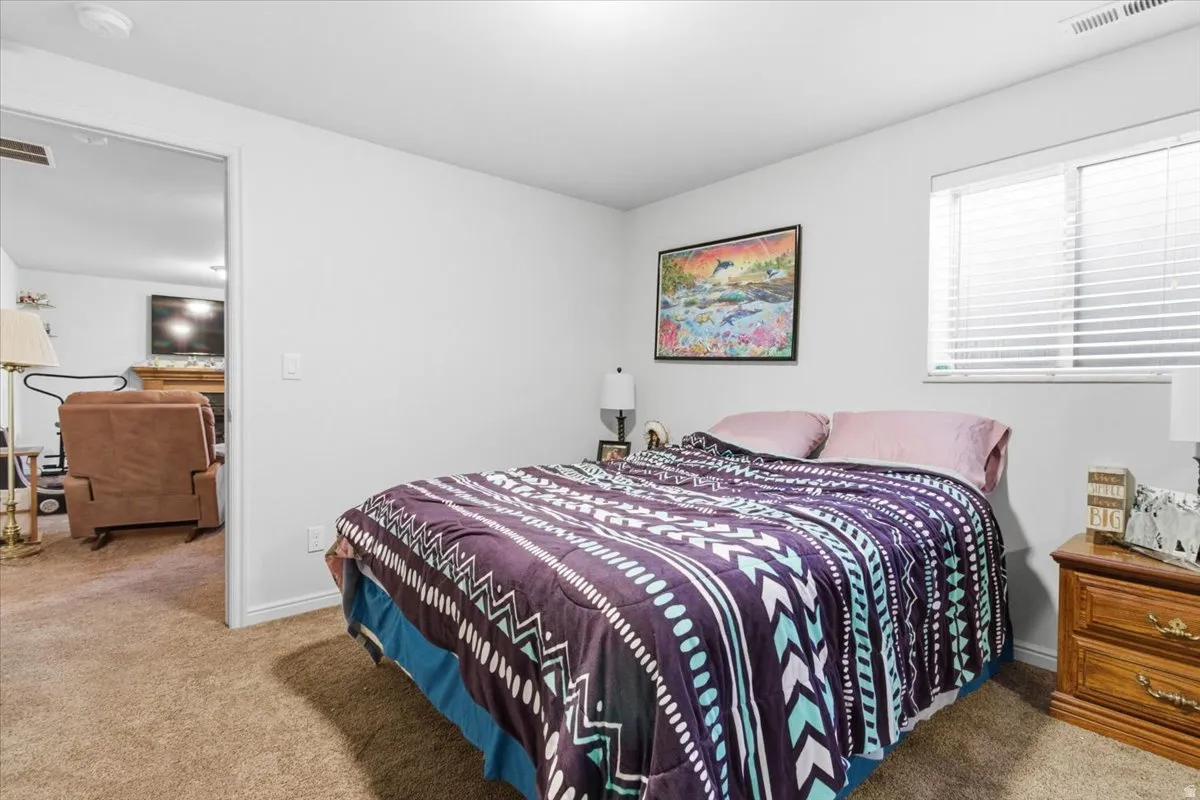 Carpeted bedroom with baseboards