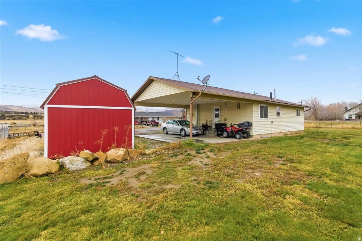 View of shed featuring a carport