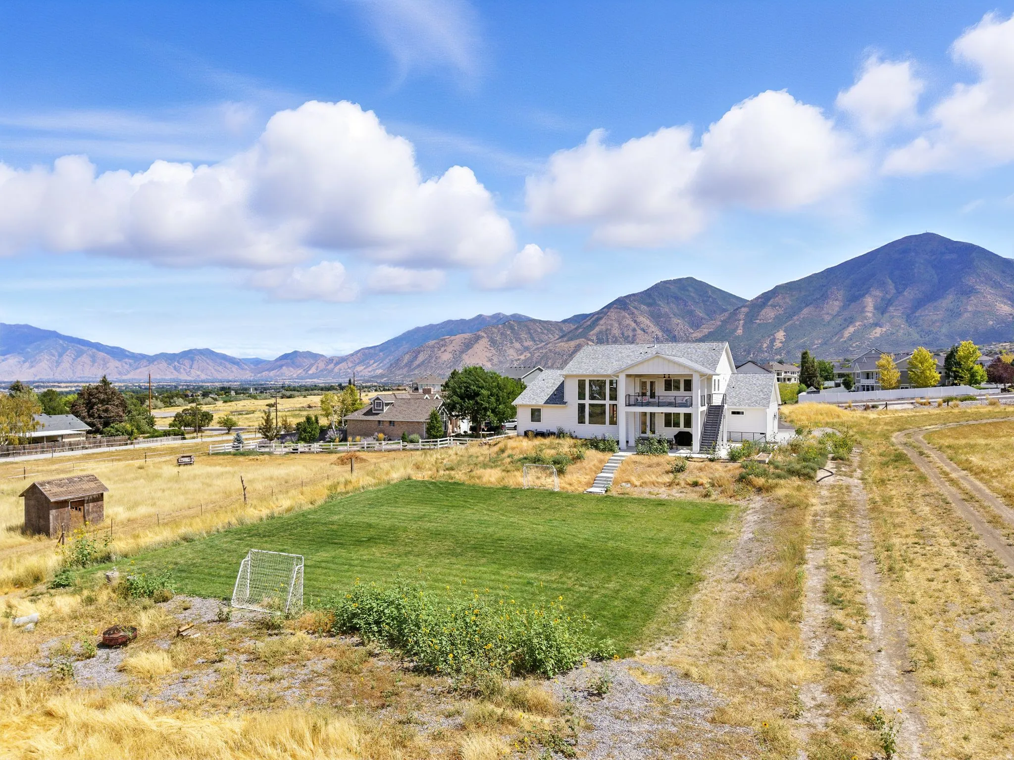 View of mountain backdrop with rural landscape