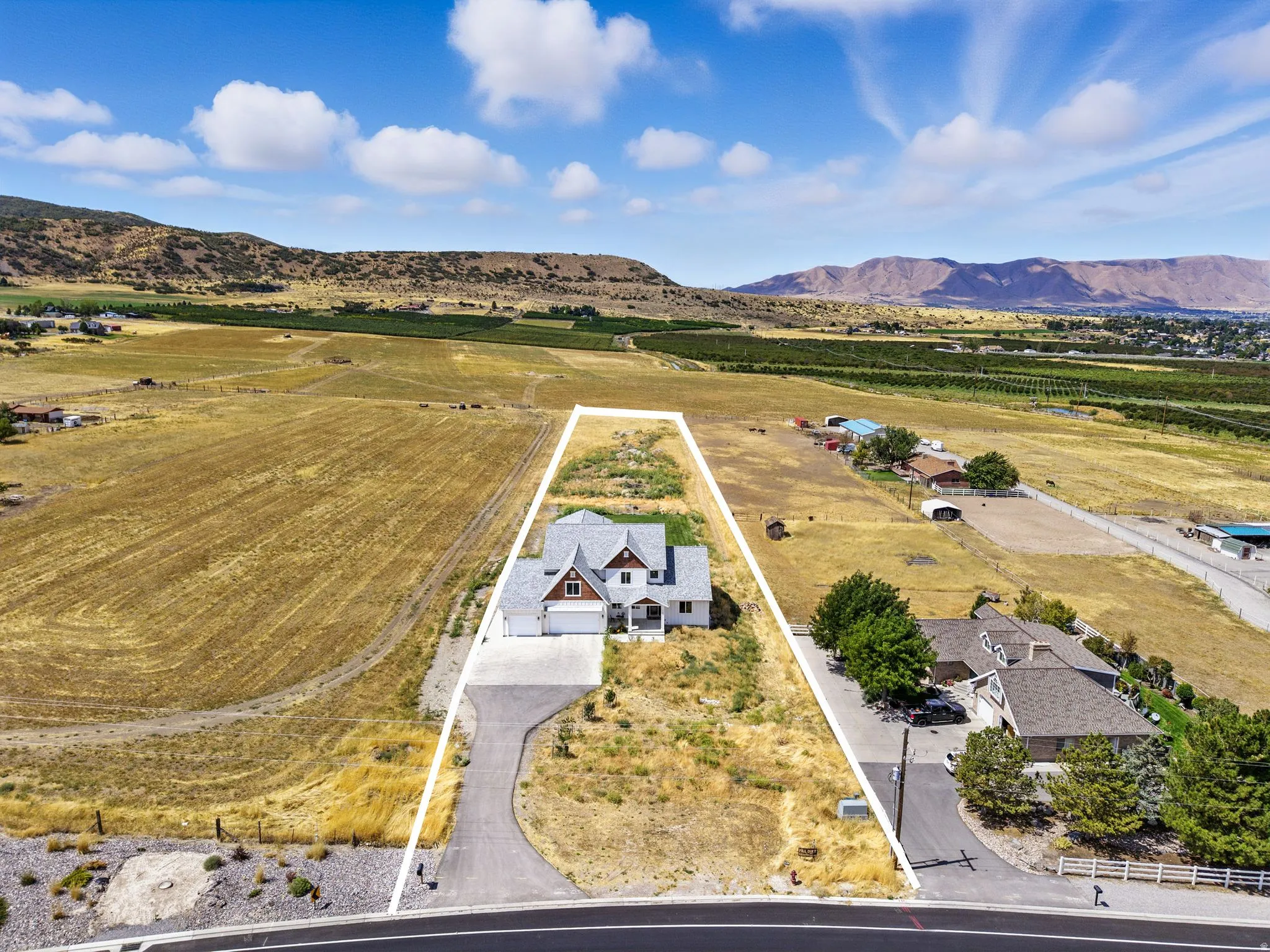 Overview of rural landscape featuring a mountainous background