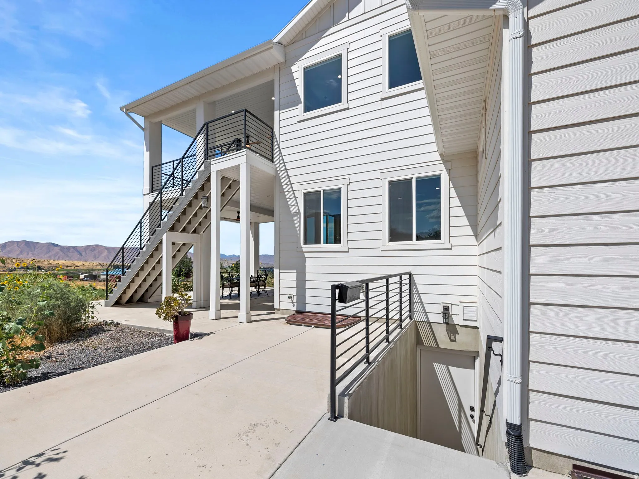 Doorway to property with a patio area and a mountain view