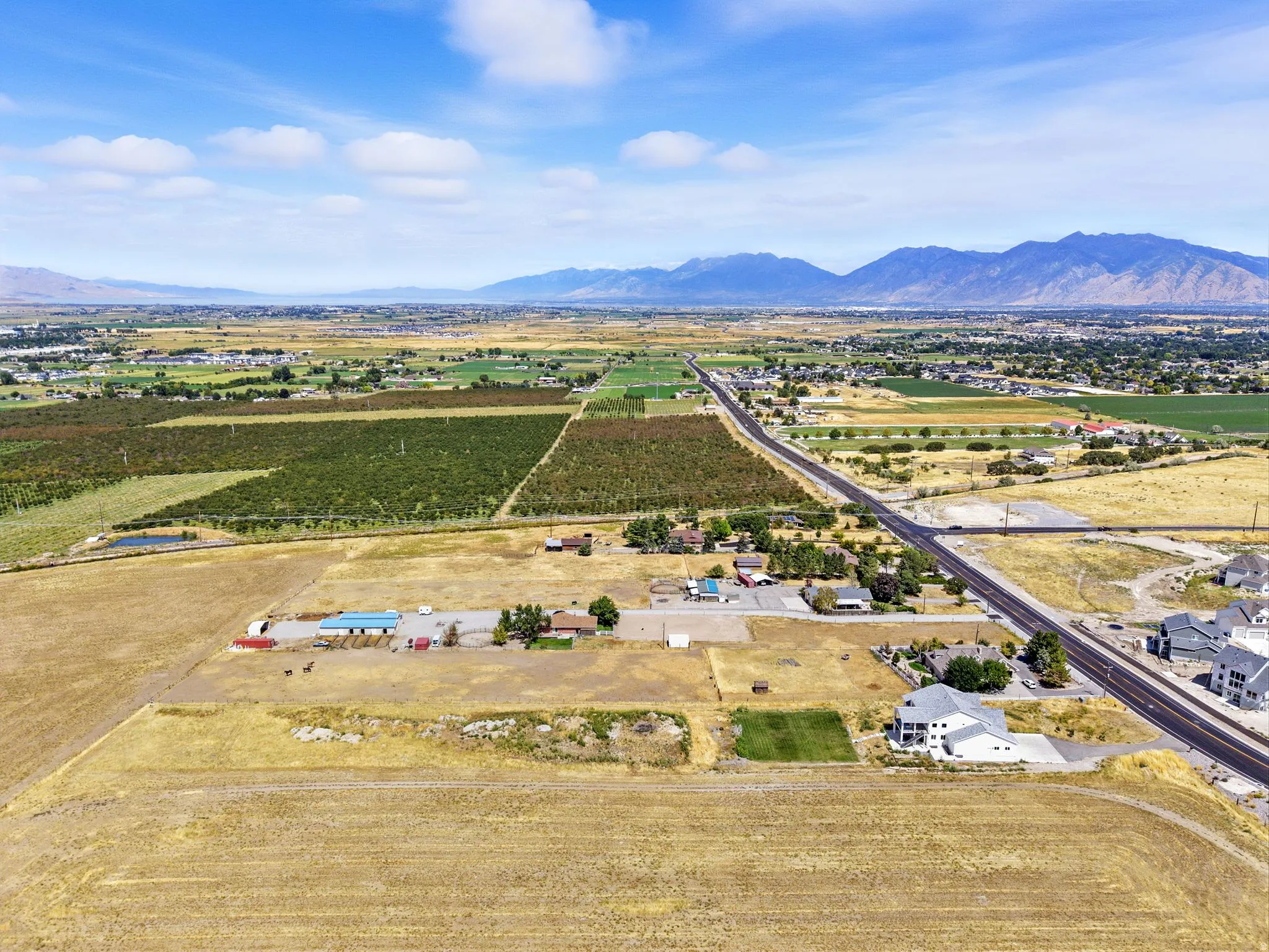 View of rural area with a mountainous background and abundant farmland