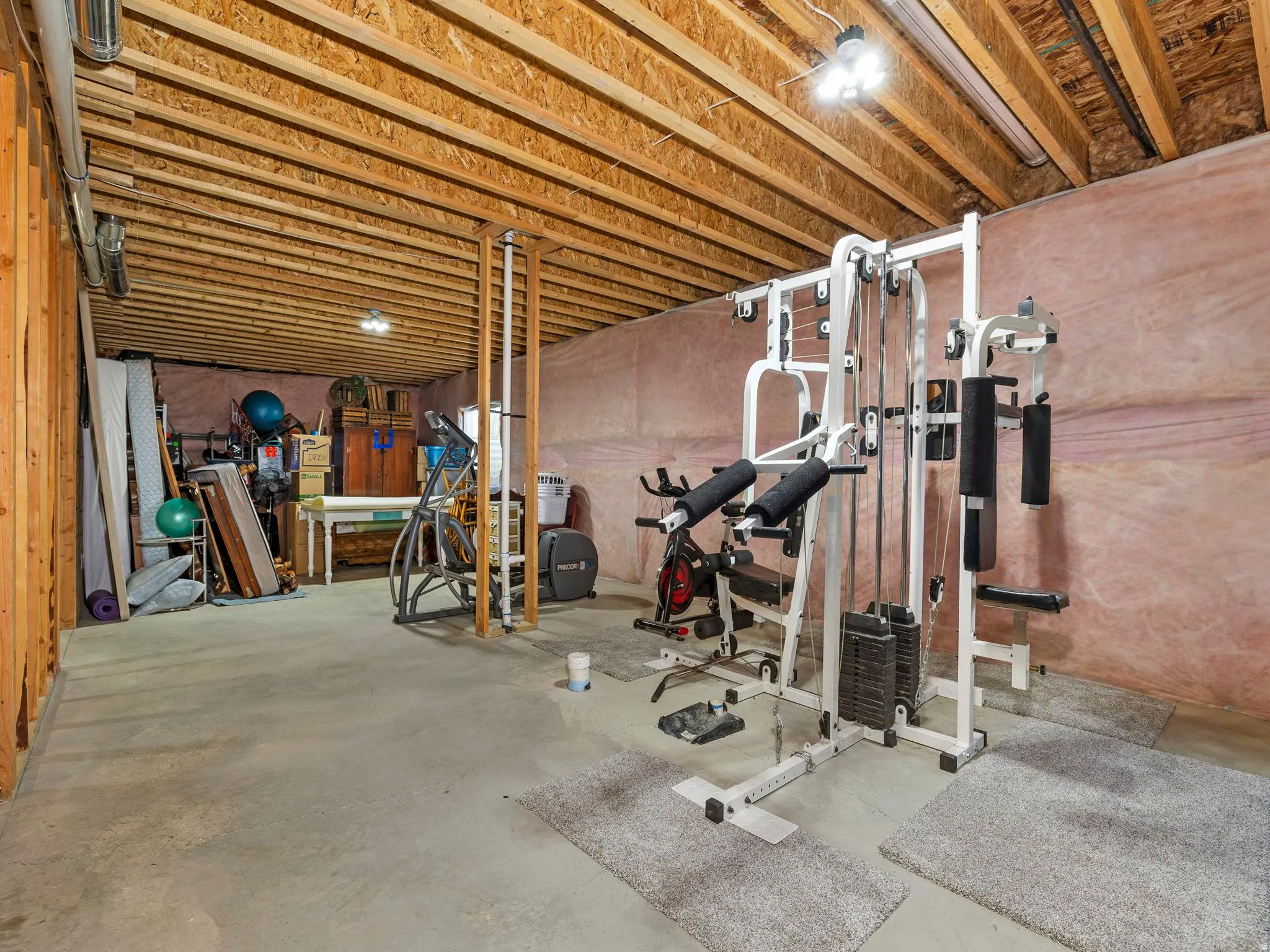 Exercise room featuring concrete floors