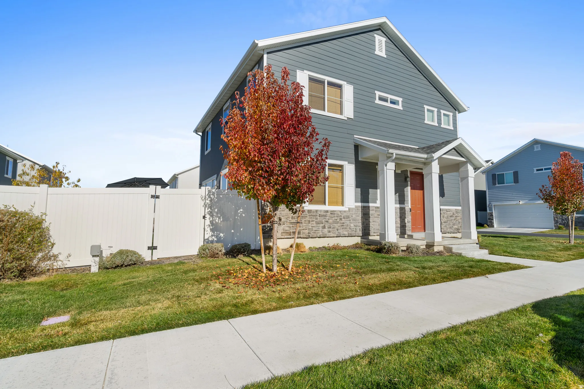View of front of house with stone siding