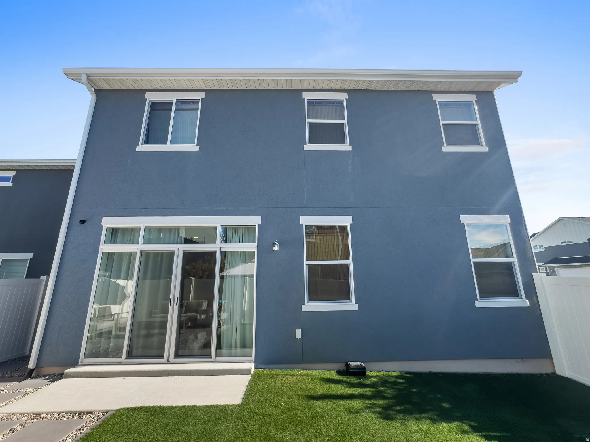 Back of property with stucco siding