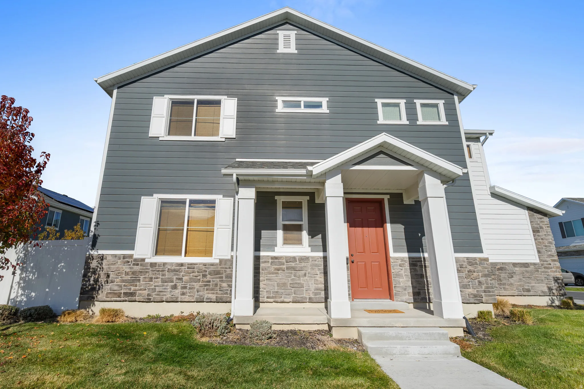 View of front of house with stone siding