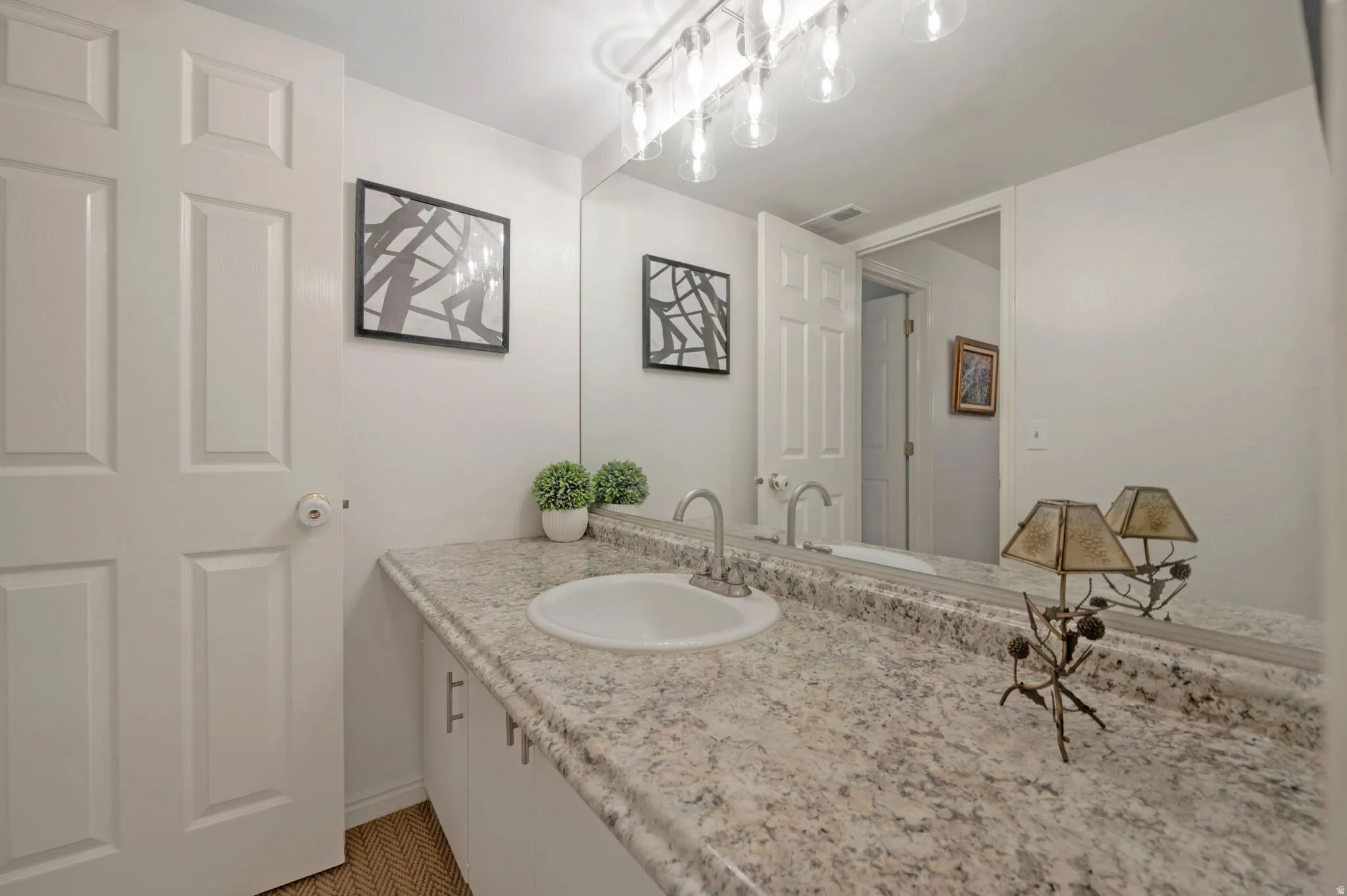 Bathroom featuring vanity and baseboards