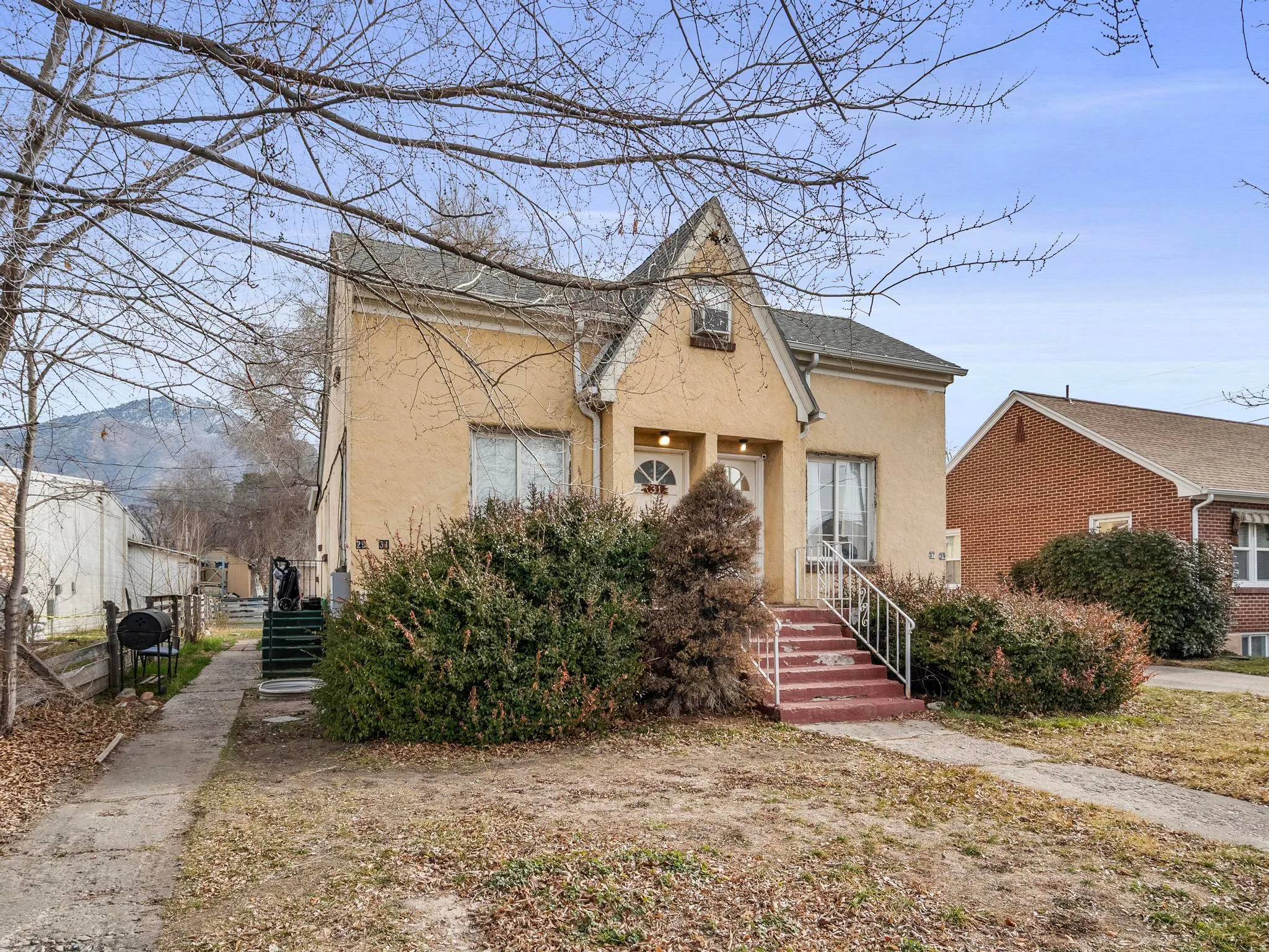 Front of 4-Plex showing showing the rear entrance to upstairs 1 bedroom unit