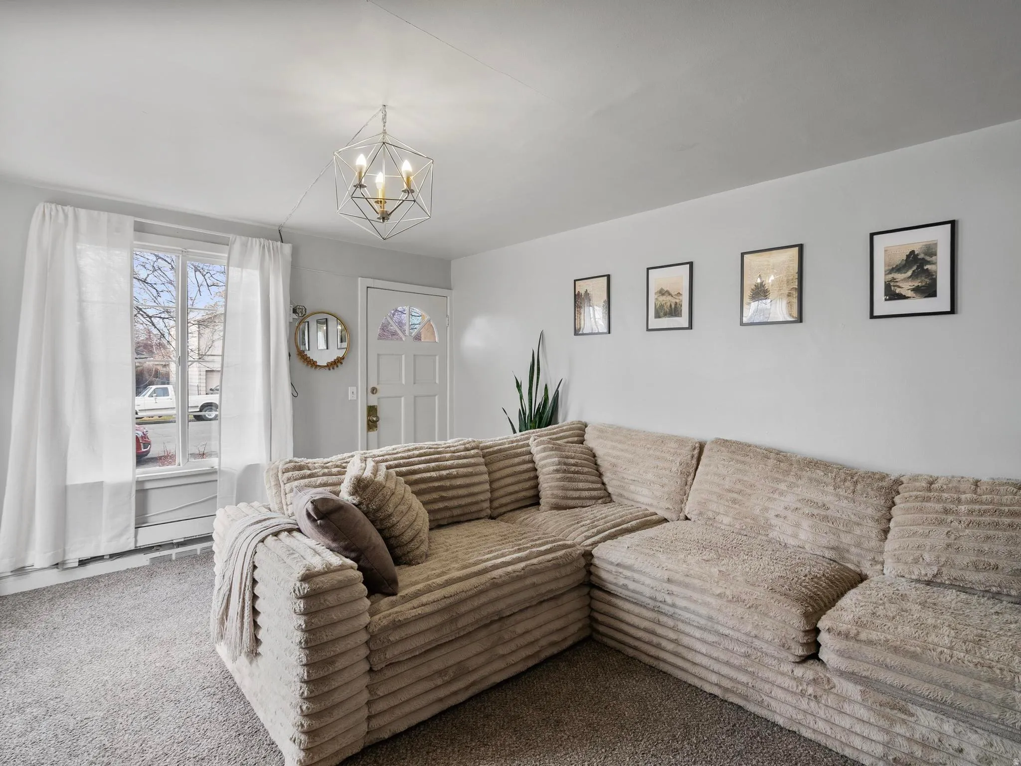 #37 (Upstairs 2-bedroom): Living area featuring carpet flooring and lots of natural light