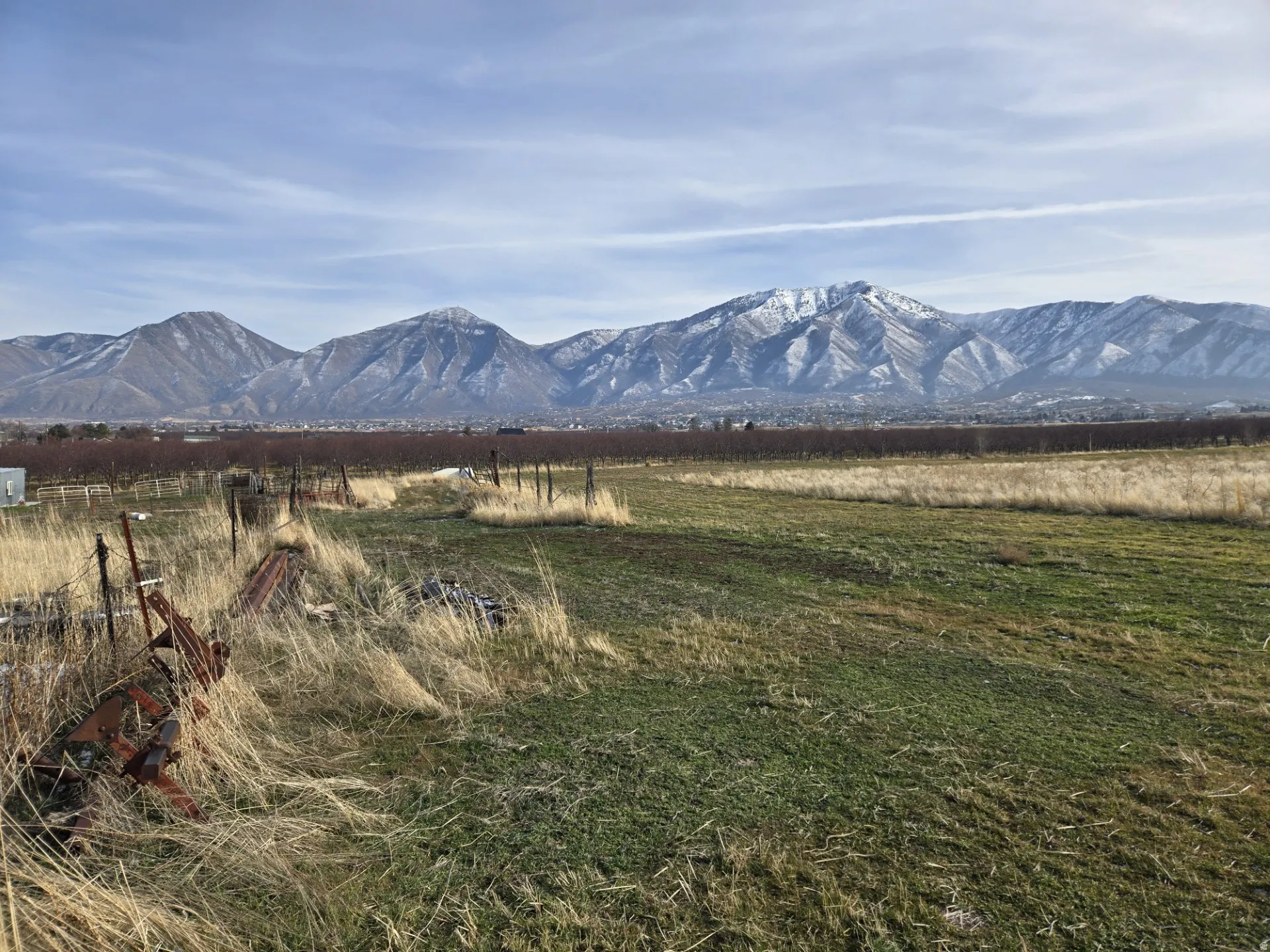 View of mountain backdrop with rural landscape