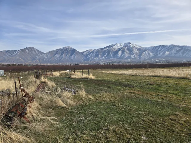 View of mountain backdrop with rural landscape