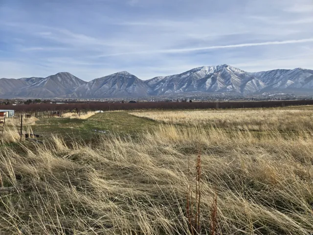 View of mountain background featuring rural landscape